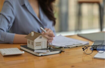 Woman Signing a Lease Agreement