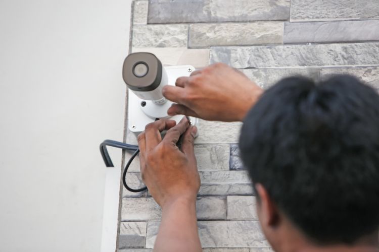 Tenant Installing Security Camera
